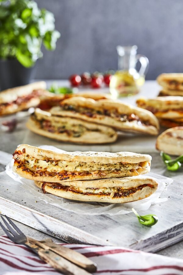 Stacked 7 inch Piegatta Calzone Pizza folded pizza bases — wholesale foodservice product supplied by Rylance Farm Foodservice